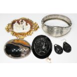 A mixed lot of antique jewellery comprising a bangle marked 'Silver', a yellow metal mounted shell