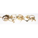 A mixed lot comprising five rings; one marked '18ct', the others hallmarked 9ct gold or marked '