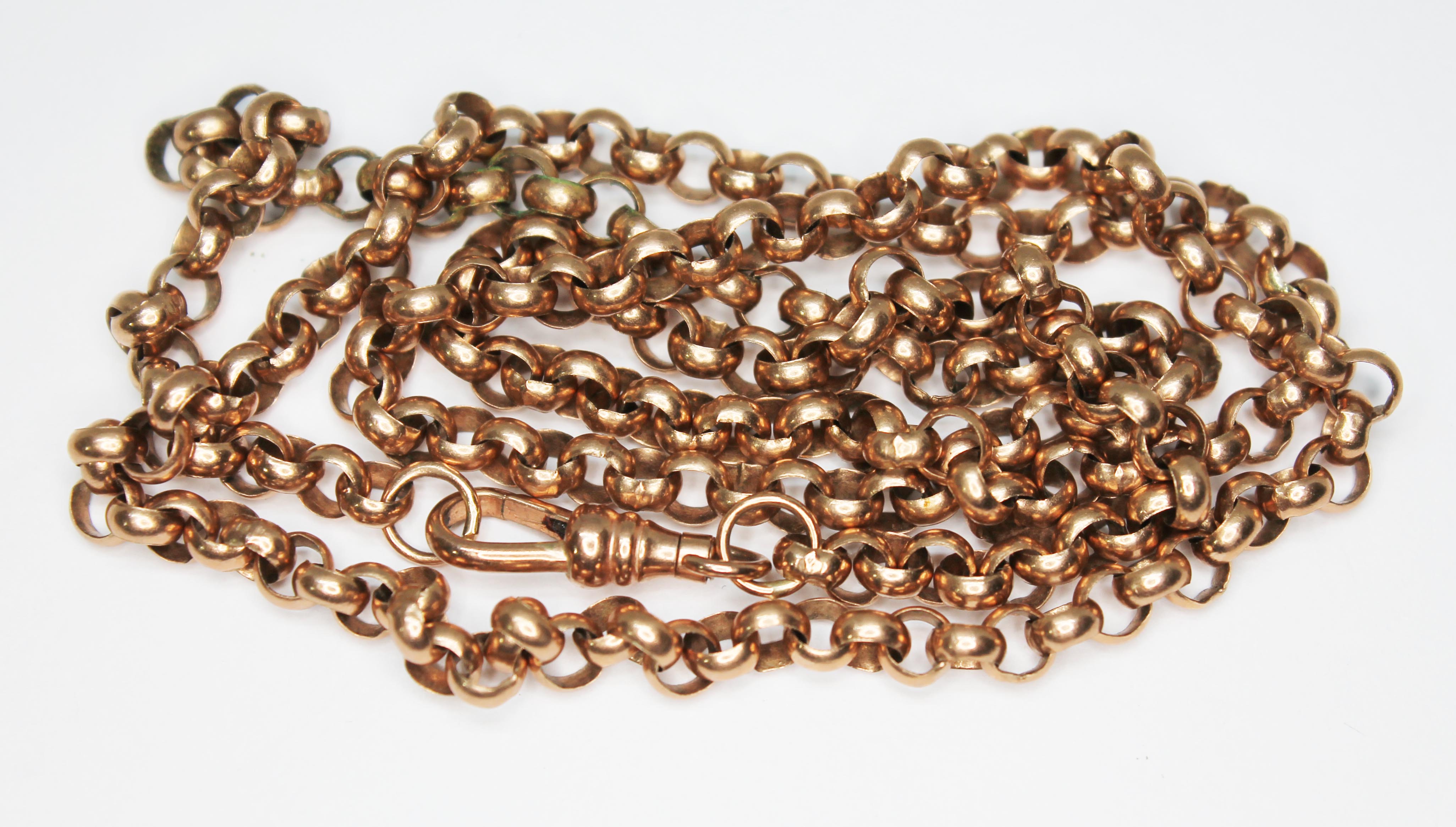 A hallmarked 9ct rose gold rolo link guard chain with hinge clip clasp, length 63cm, wt. 24.3g.