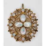 An opal pendant brooch, four central millegrain set oval opal cabochons surround by eight bezel