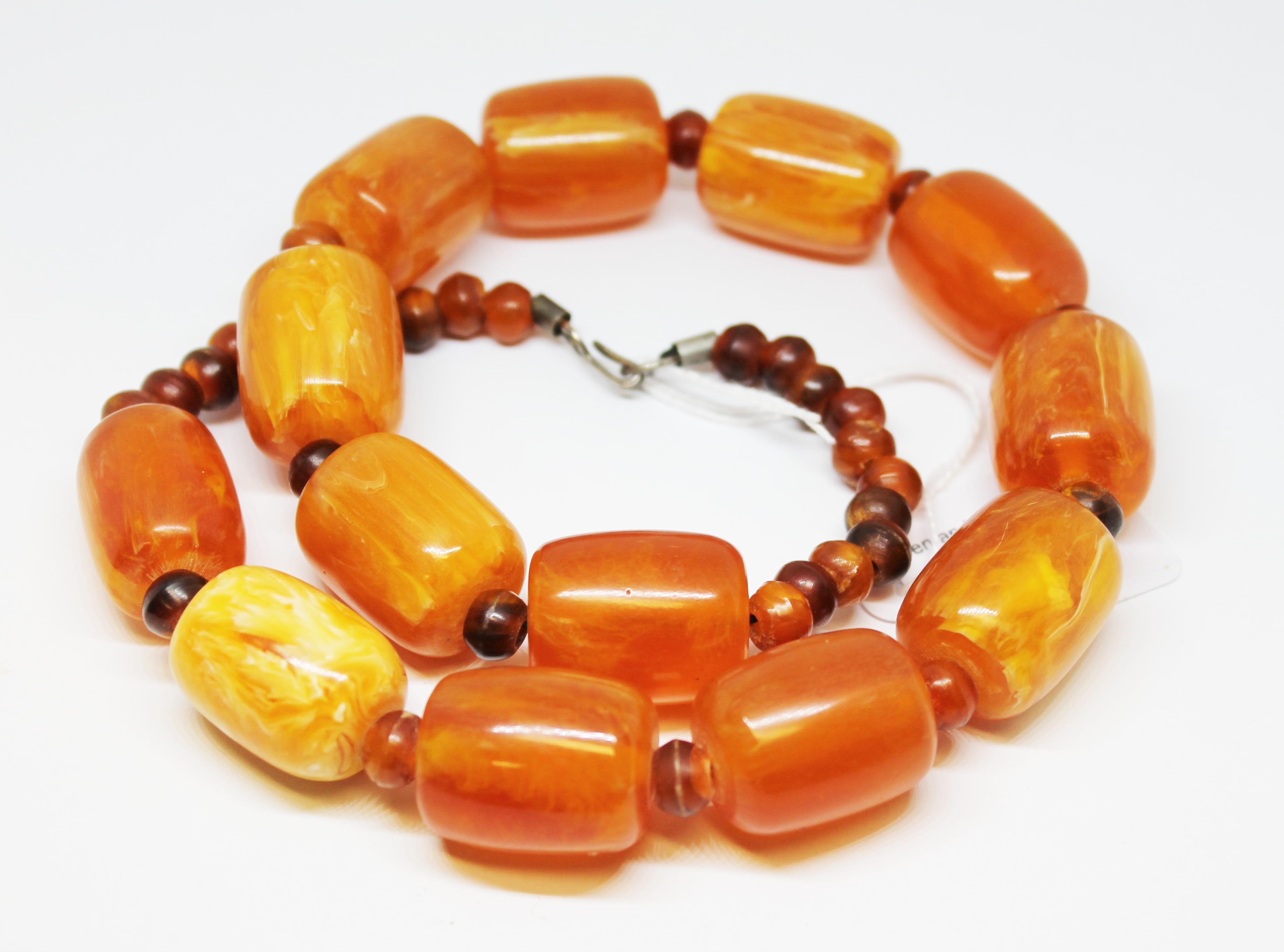 A butterscotch plastic bead necklace, length 54cm, gross wt. 114g. - Image 3 of 8