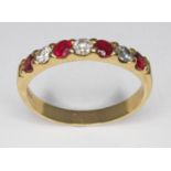 A seven stone diamond and ruby ring, total approx. diamond wt. 0.30ct, hallmarked 18ct gold, sponsor