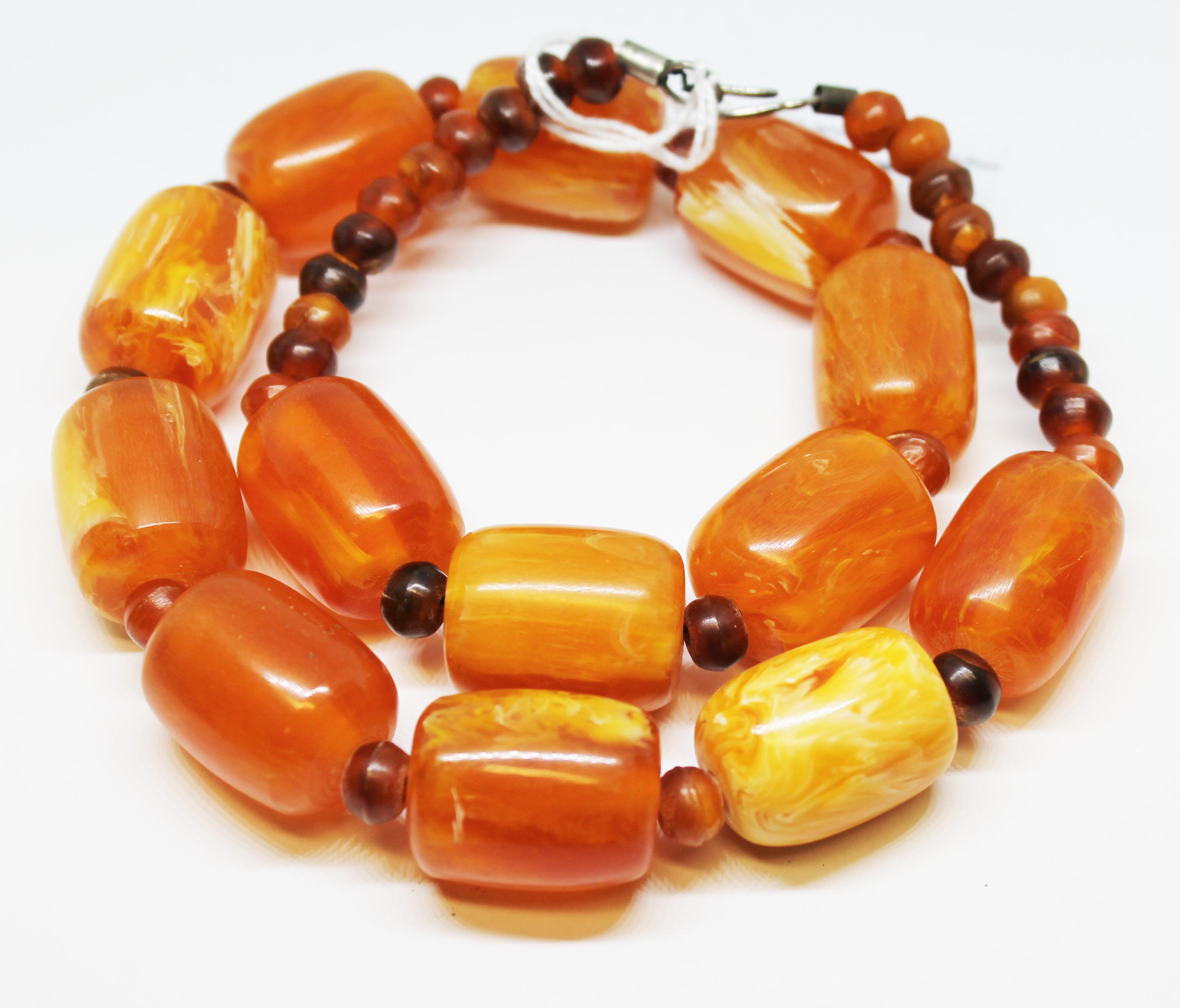 A butterscotch plastic bead necklace, length 54cm, gross wt. 114g. - Image 8 of 8