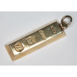 A hallmarked 9ct gold ingot, length 30mm, wt. 10.3g.