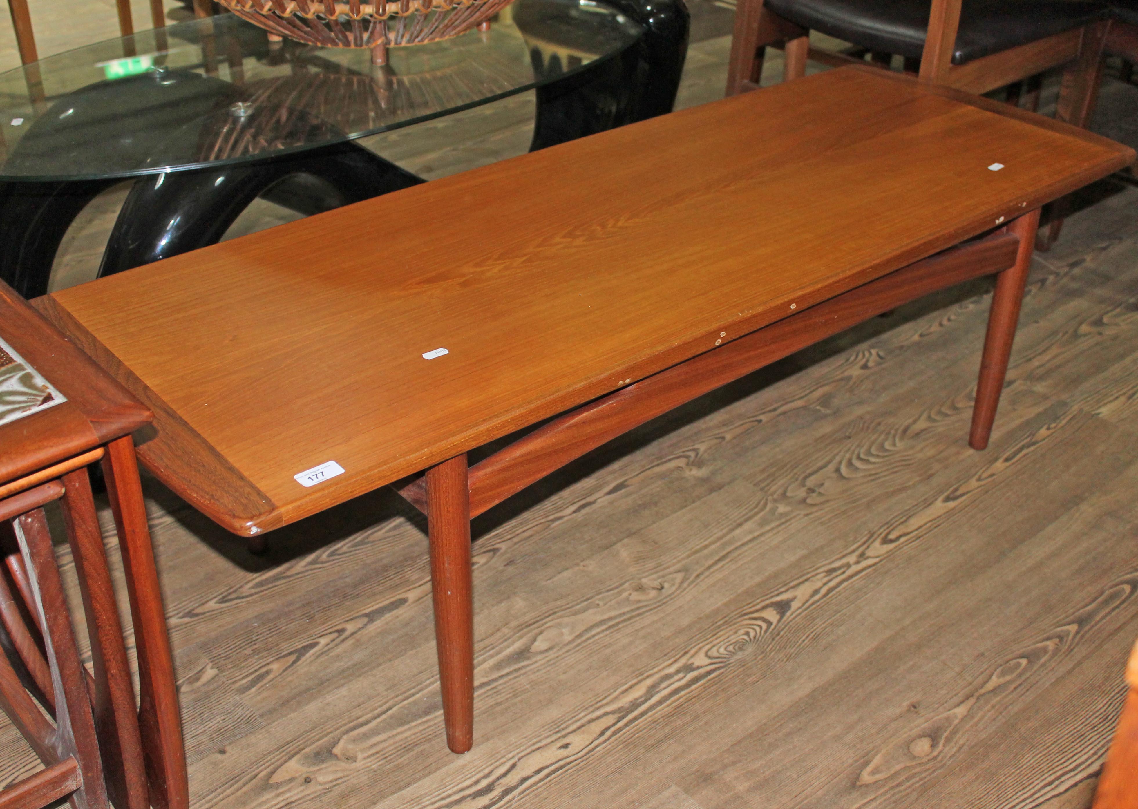 A mid 20th century teak coffee table by younger, length 137cm.