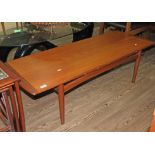 A mid 20th century teak coffee table by younger, length 137cm.