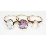 A group of three rings: an aquamarine ring weighing approx. 2.56ct unmarked, a hallmarked 9ct gold