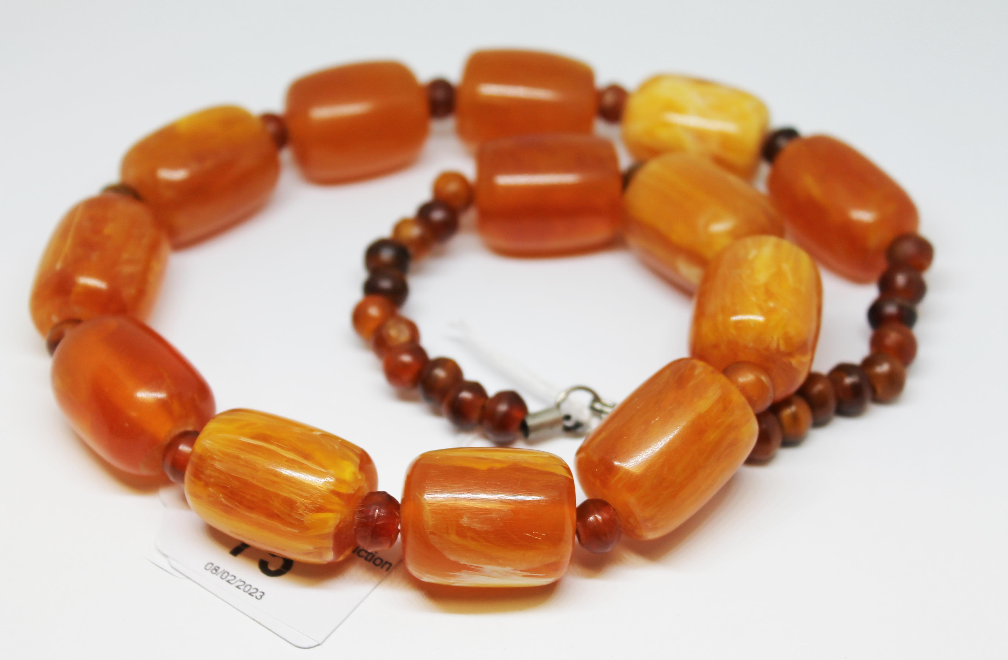 A butterscotch plastic bead necklace, length 54cm, gross wt. 114g. - Image 2 of 8