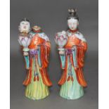 A pair of Chinese over enamelled porcelain figures, late 18th/early 19th century, height 29cm.