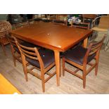 A mid 20th century teak extending dining table and six chairs by Younger, length 145.5cm extending