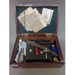 Theatrical prop; a marquetry inlaid box containing a 'vampire hunting kit' including stake, bible,