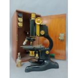 A W. Watson & Sons Ltd "Service" microscope with accessories in wooden case.