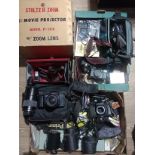 2 boxes of cameras and accessories to include a cine cam, Olympus DX, vintage headphones, Chinon,