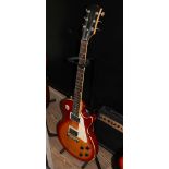 A Gibson Baldwin Music Education Signature series electric guitar with stand and a Studio 10S Gibson