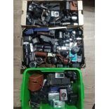 3 boxes of various cameras and accessories to include Polaroid, Cannon, Agfa, lenses, flash,