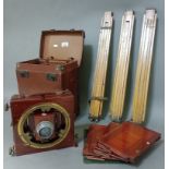 A Thornton Pickard mahogany cased field camera with tripod and 3 plates.