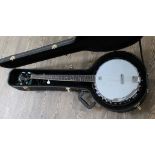 A Gremlin 5 string banjo with hard case.