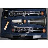 A Corton clarinet with hard case.