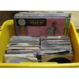 A box of assorted 45s and LPs, circa 1970s and later.