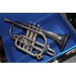 A silver plated cornet by J Higham Manchester with hard case.