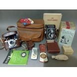 A Rolleicord V camera with accessories together with a Voigtlander Vito B camera.