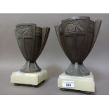 2 Art Deco cast vases on plynths