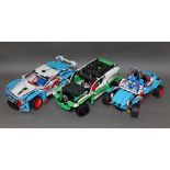 A group of three Lego Technic racing vehicles