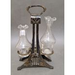 A WMF silver plated cruet stand with two non matching glass bottles, height 25cm, marked WMF.