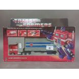 A vintage G1 Optimus Prime Transformers toy, boxed.