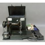 A Singer portable sewing machine 221K1.