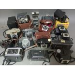 A box containing vintage cameras; Kodak, Ilford, Eumig etc.