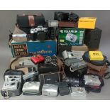 Two boxes of cameras and accessories to include Brownie, box cameras, folding cameras, Olympia,