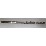 An early 20th century nickel mounted rosewood flute by Ward & Son, Liverpool.