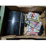 A Playstation 3 with various games.