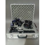 A Canon EOS 1000F and a Canon A1 camera with accessories in hard case.