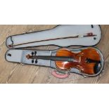 A Hungarian student violin with bow and hard case.