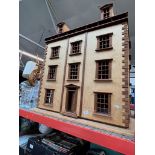 A 3 storey dolls house complete with furniture.