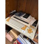 A Sharp MZ-700 personal computer and assorted vintage calculators