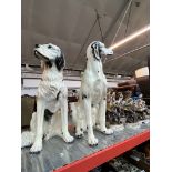 Two large ceramic dogs.