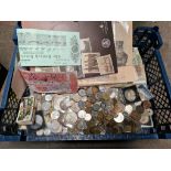 A tub of world coins and banknotes