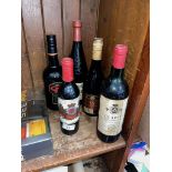 Five bottles of alcoholic beverages including 1986 Claret, brandy etc.