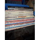 A box of LP 12" vinyl records.