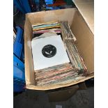 A box of vinyl 7" single records, mostly 1960s to include Richie Valens, Roy Orbison, The Shadows,
