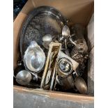 A box of mainly silver plated items to include large galleried tray, gravy boat, cutlery,