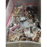 A box of assorted watches and watch parts.