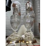 A pair of glass table lamps with shades.