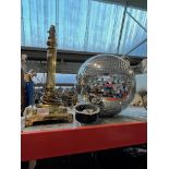 A glitter ball with motor and a brass column table lamp - no shade.