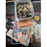 A box of world coins and banknotes.