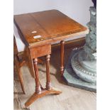 A Victorian walnut and birds eye maple Sutherland table.