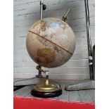 A vintage globe on brass stand.